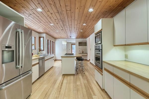75 Mill Road Chelmsford, MA 01824 - Photo 6 of 17 a large kitchen with a large window a counter space stainless steel appliances and cabinets