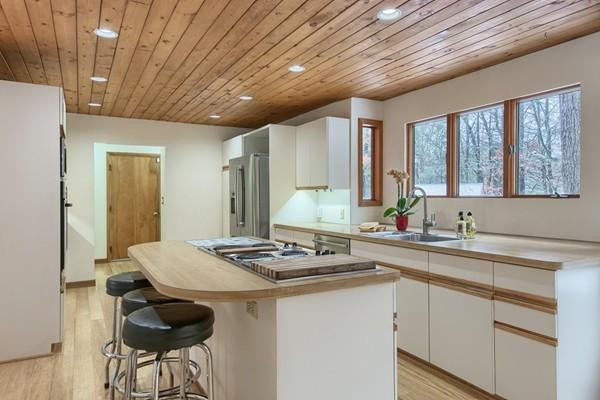 75 Mill Road Chelmsford, MA 01824 - Photo 7 of 17 a kitchen with stainless steel appliances granite countertop a sink stove and cabinets
