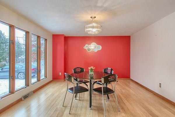 75 Mill Road Chelmsford, MA 01824 - Photo 8 of 17 a view of a dining room with furniture window and wooden floor