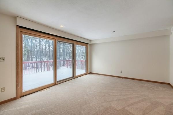 75 Mill Road Chelmsford, MA 01824 - Photo 10 of 17 a view of an empty room with wooden floor and a window