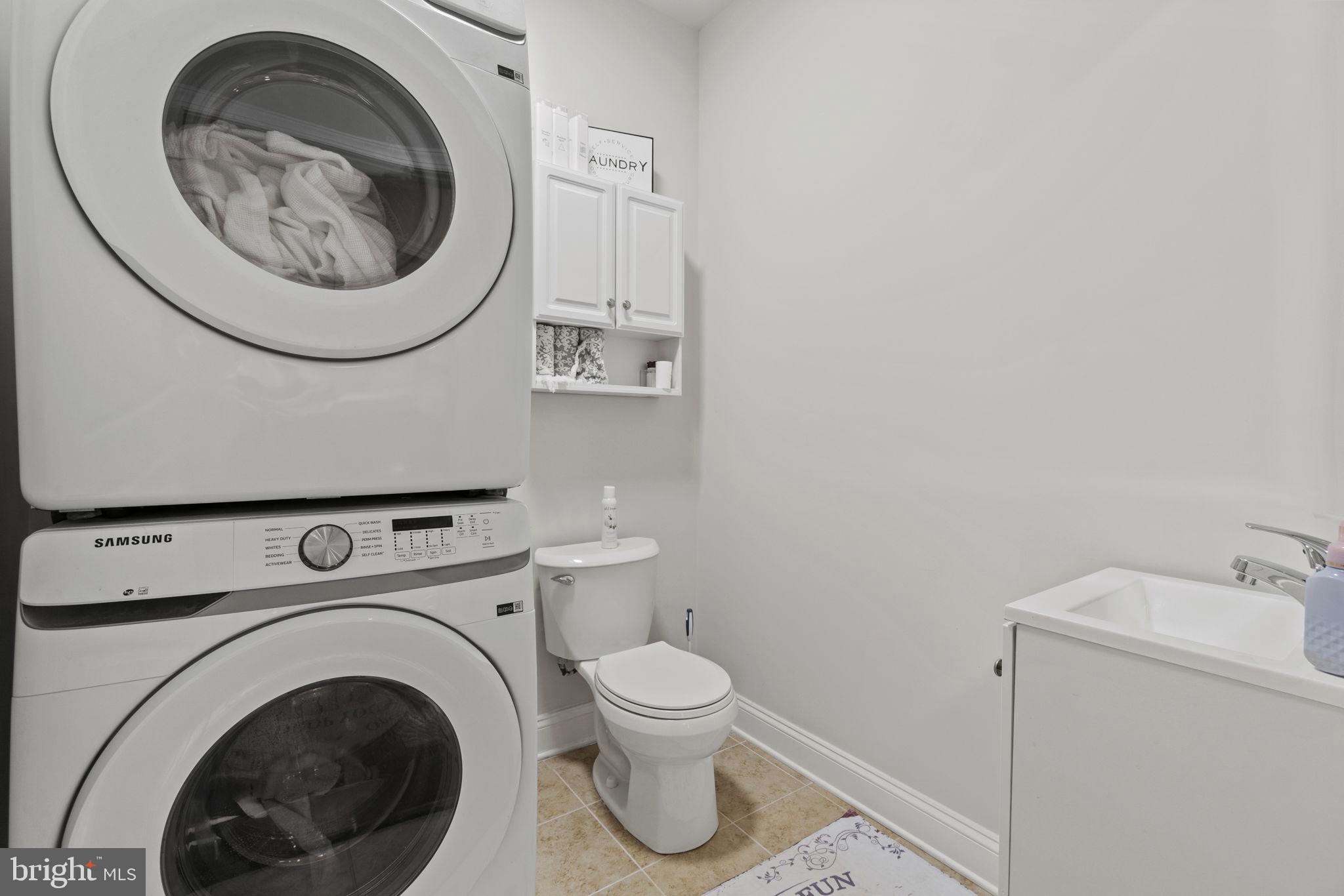 7946 Rogues Road Catlett, VA 20119 - Photo 22 of 50 a utility room with dryer and washer