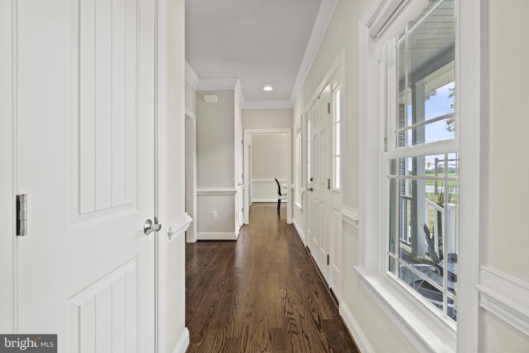 7946 Rogues Road Catlett, VA 20119 - Photo 23 of 50 a view of a hallway with wooden floor and staircase