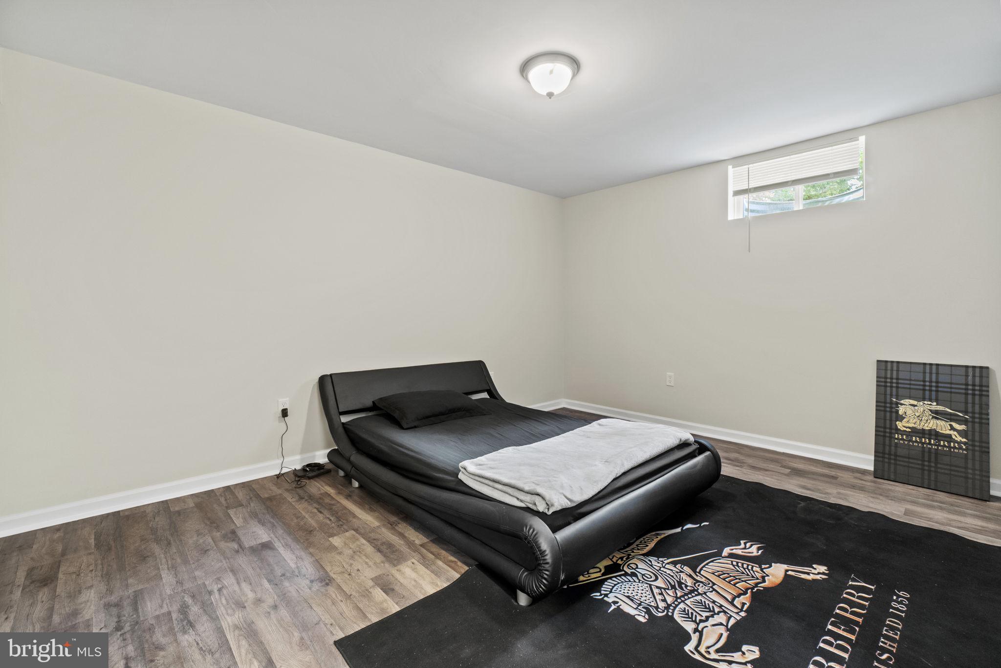 7946 Rogues Road Catlett, VA 20119 - Photo 25 of 50 a room with furniture and a wooden floor