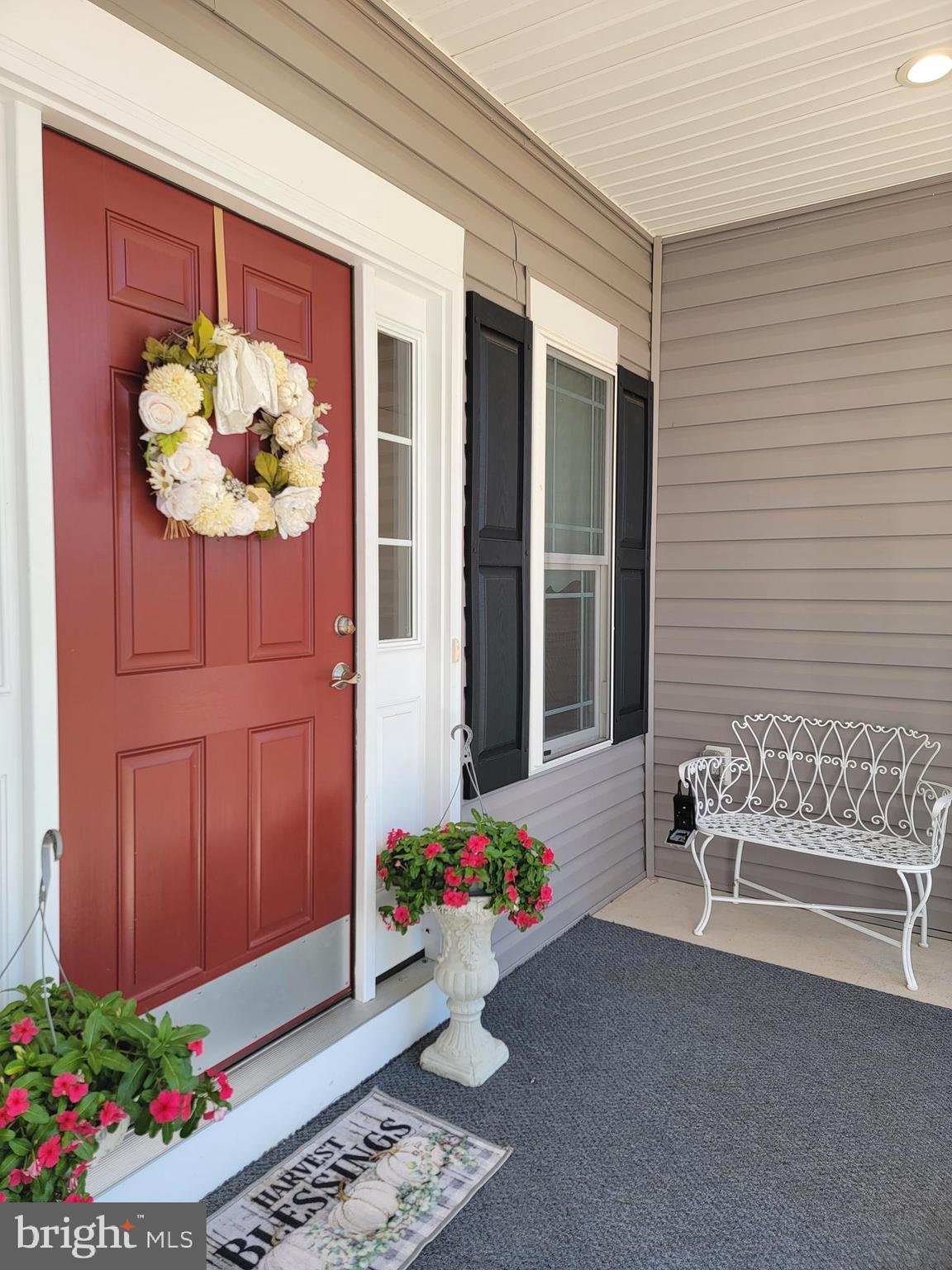 7946 Rogues Road Catlett, VA 20119 - Photo 3 of 50 a flower pot with a bench