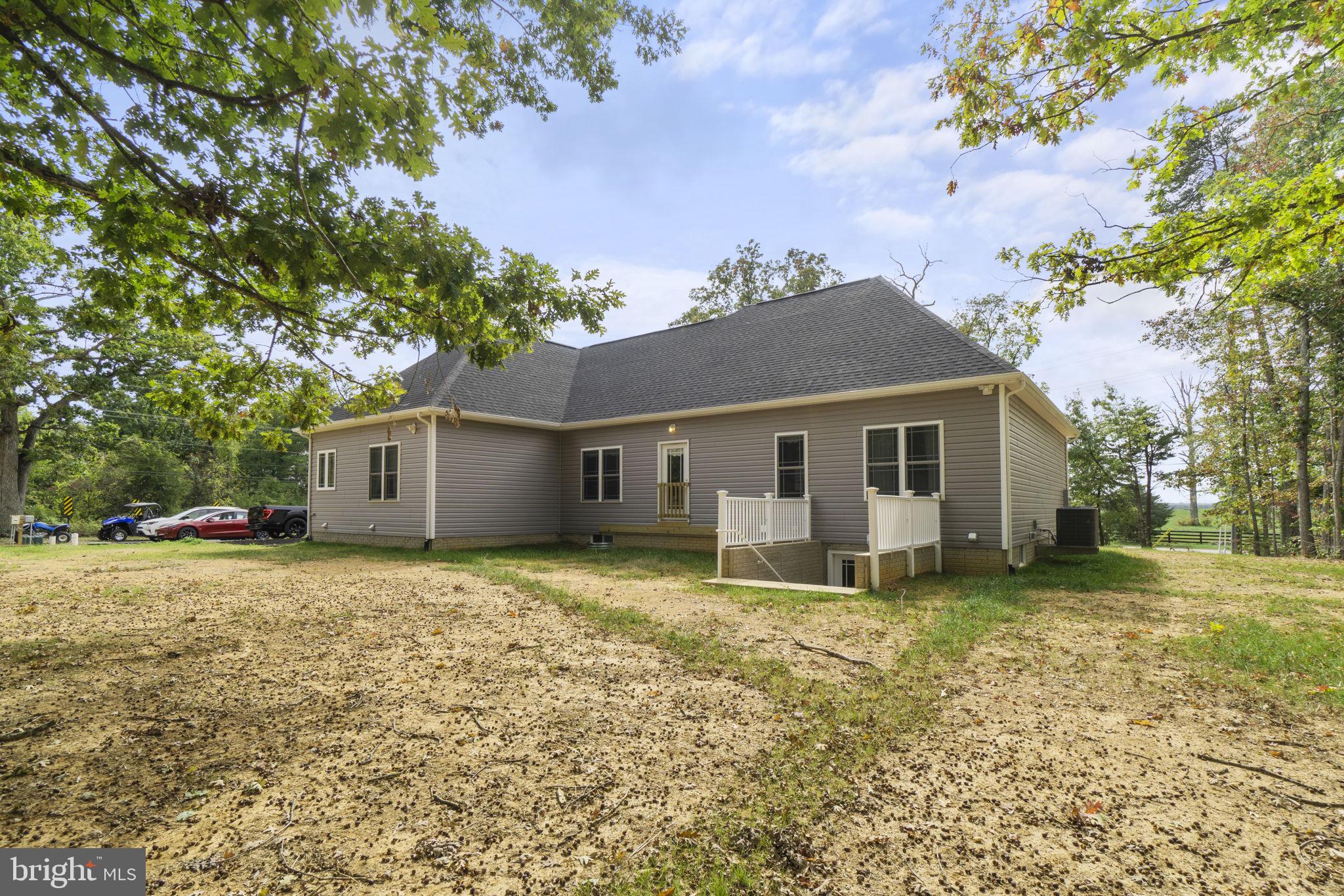 7946 Rogues Road Catlett, VA 20119 - Photo 35 of 50 a house that has a tree in front of it