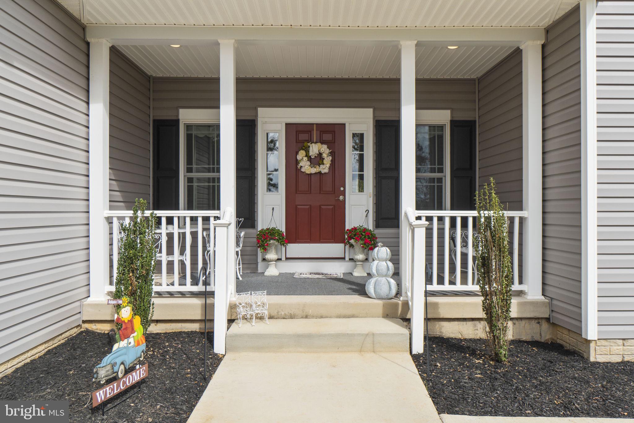 7946 Rogues Road Catlett, VA 20119 - Photo 4 of 50 a view of a house with a large windows and plants