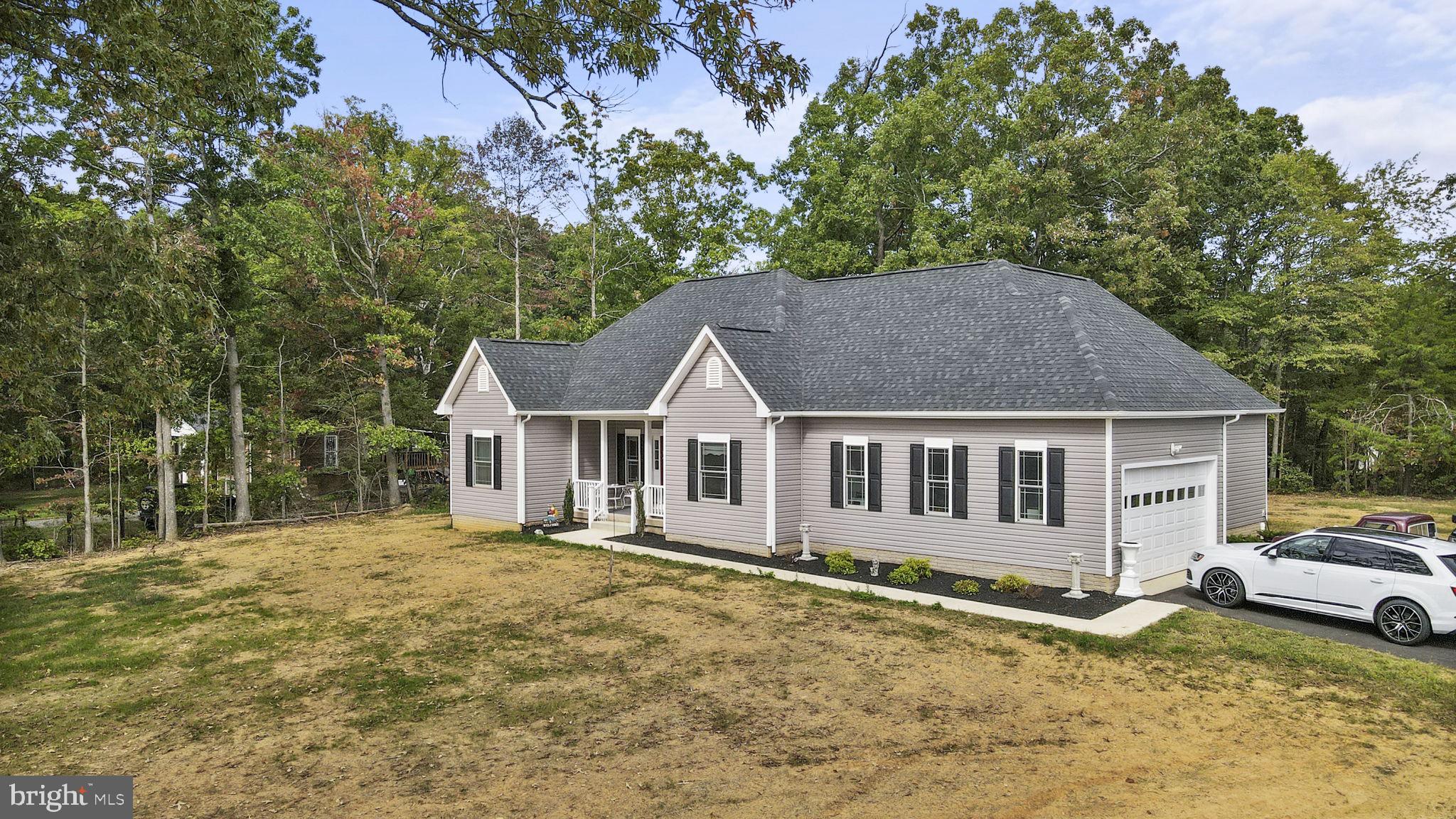 7946 Rogues Road Catlett, VA 20119 - Photo 46 of 50 a house with a large tree in front of it