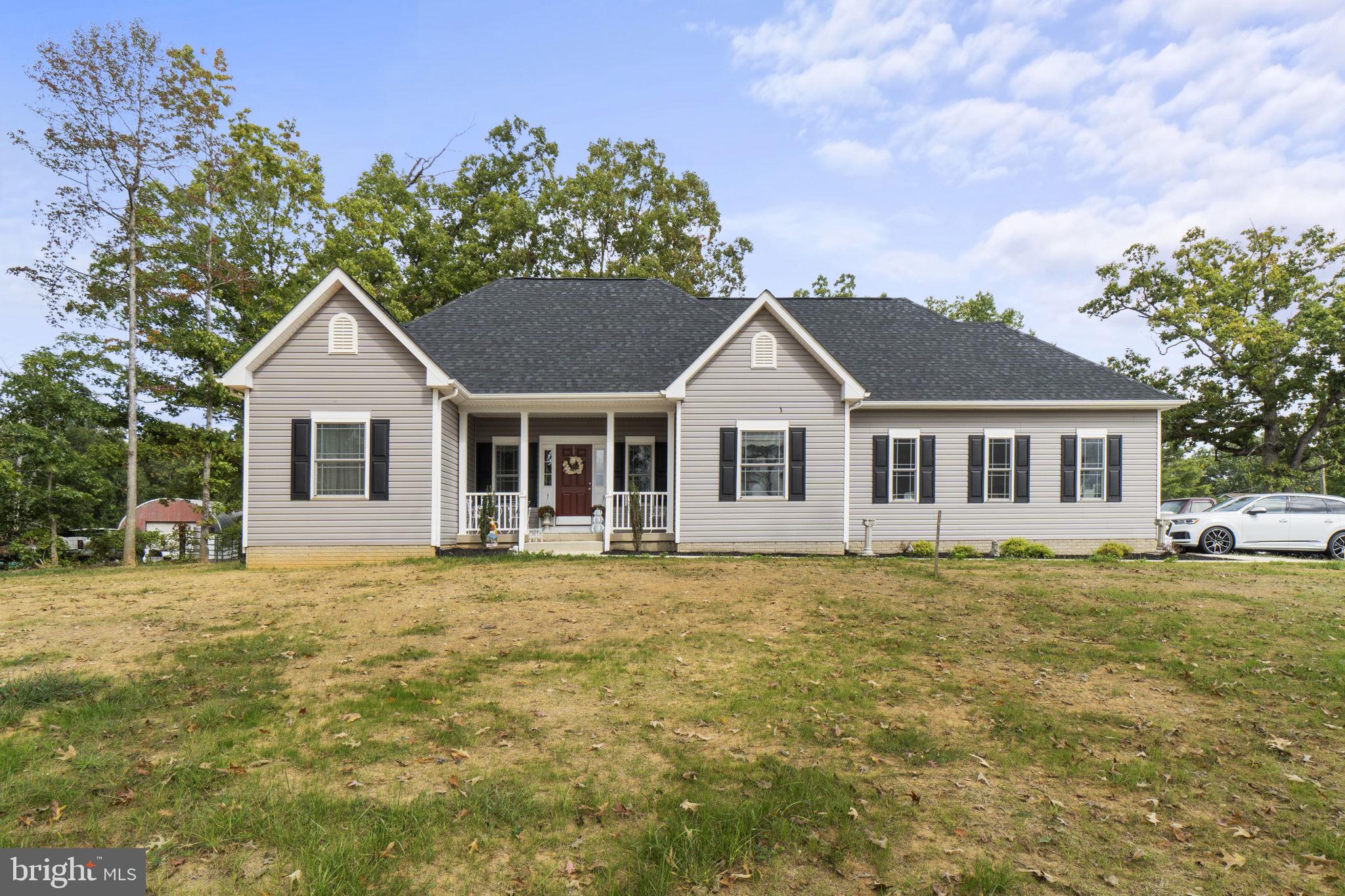 7946 Rogues Road Catlett, VA 20119 - Photo 48 of 50 a front view of a house with a garden