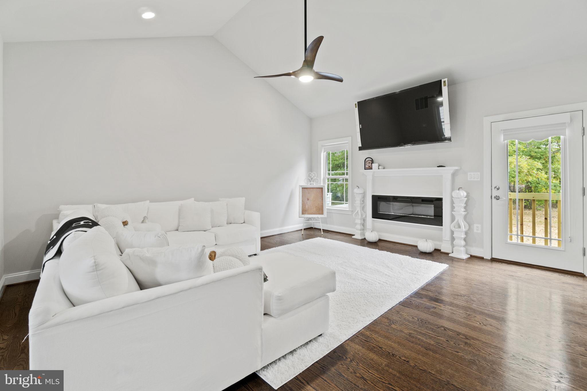 7946 Rogues Road Catlett, VA 20119 - Photo 5 of 50 a living room with furniture fireplace and flat screen tv