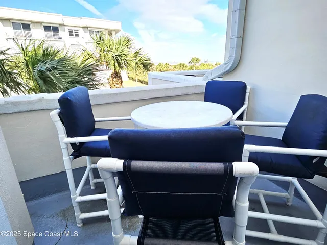 a bedroom with a bed next to a window