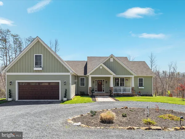 a view of a house with a swimming pool and a yard