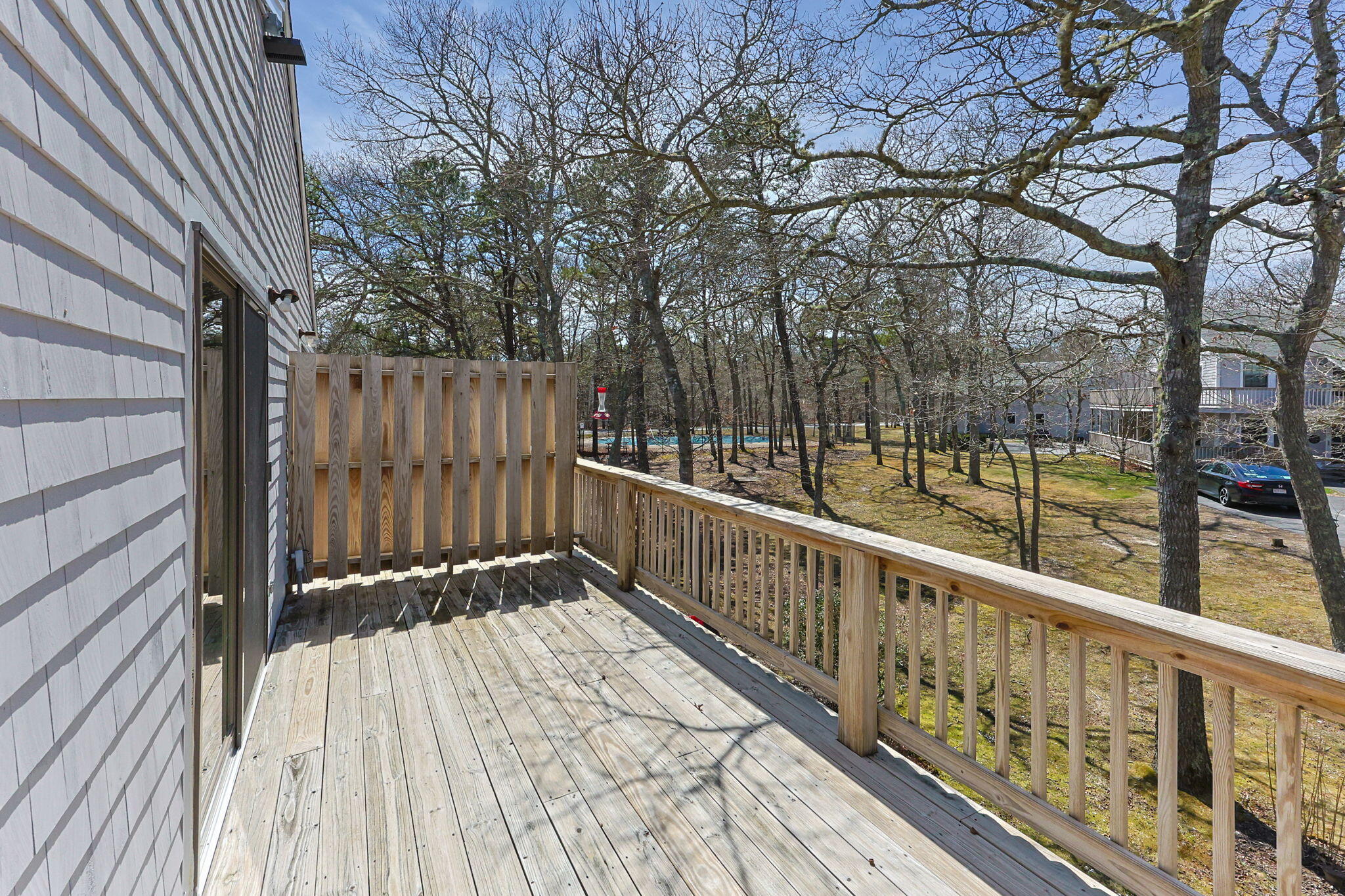 35 Ashumet Road, Unit 8C Mashpee, MA 02649 - Photo 19 of 24 a view of balcony with wooden floor and fence