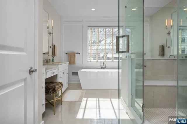 a living room with a large window and furniture