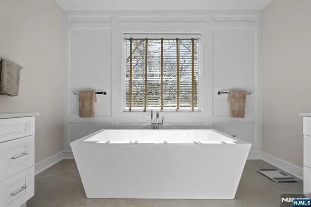 a white bath tub sitting in a bathroom
