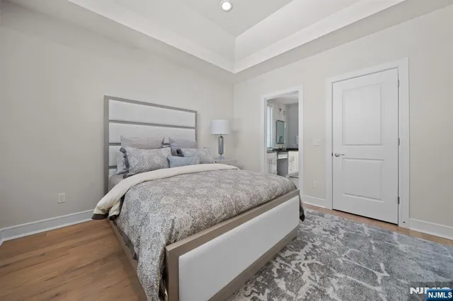 a bedroom with a bed and walk in closet