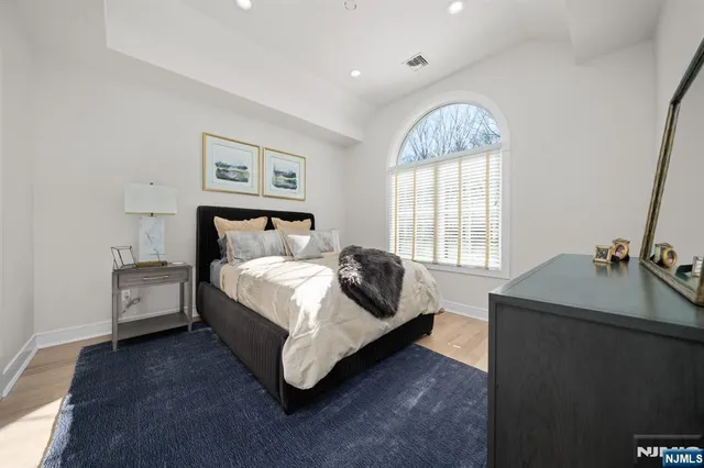 a bed room with a bed and a window