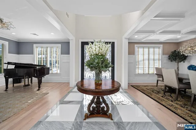 a living room with furniture a window and a table