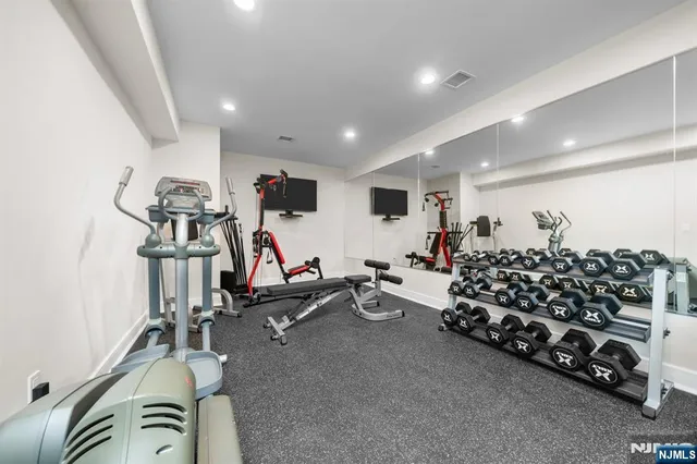 a large room with gym equipment and a large window