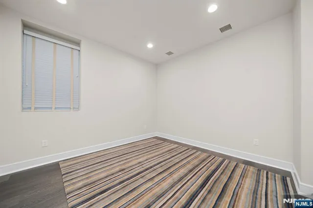 a view of room with wooden floor