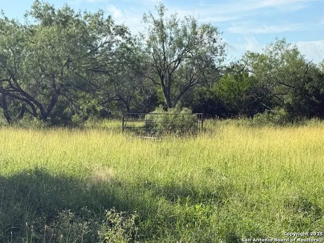 a view of a lake view with houses in back