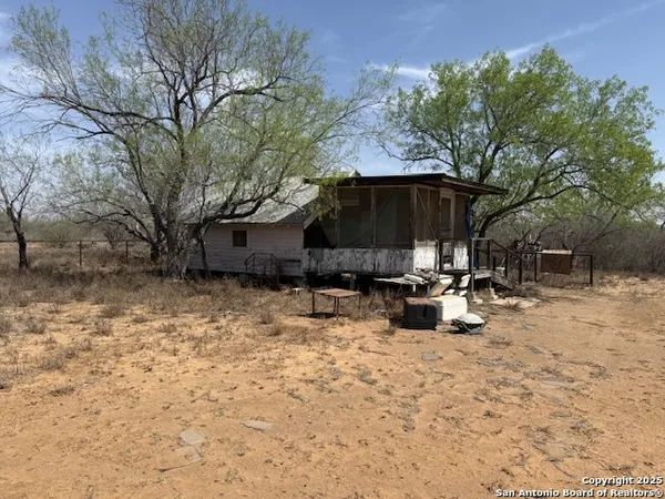 a living room filled with furniture and a table