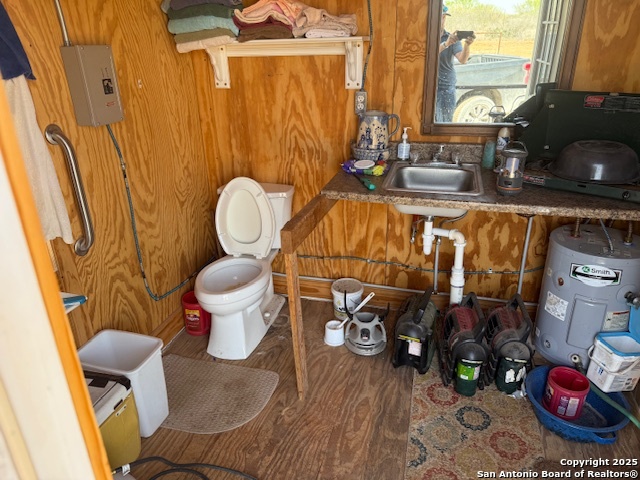 0 Los Alamos Road Cotulla, TX 78014 - Photo 9 of 41 a bathroom with a toilet sink and mirror