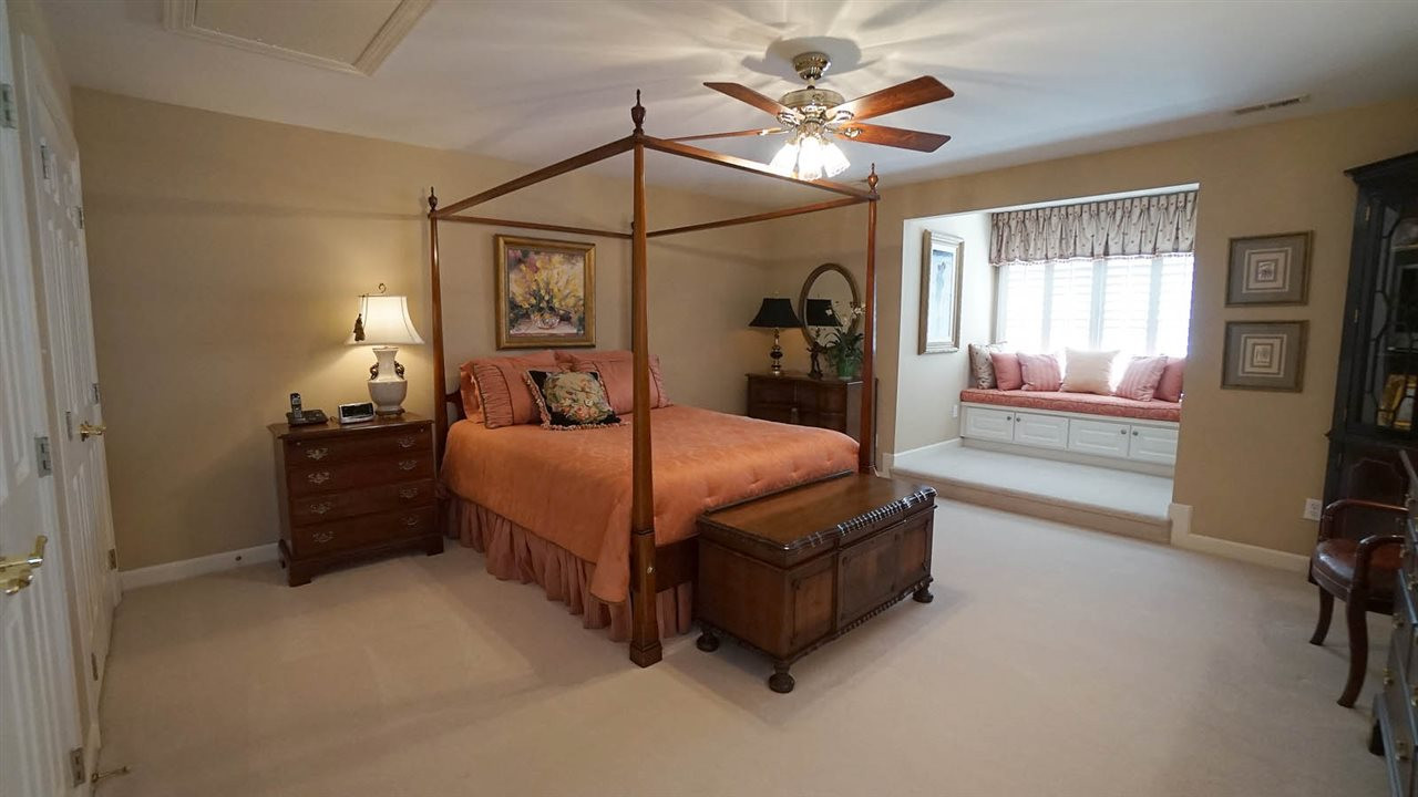 1900 Torrington Street Raleigh, NC 27615 - Photo 23 of 30 Spacious private guest suite w/ double closet area, and built in seating area w/ storage. Additional pull down storage with sealed attic for ultimate energy efficiency Guest Bedroom