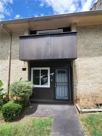 a front view of a house with a garage
