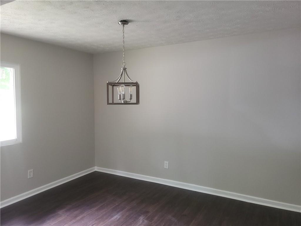 1867 Myrtle Drive Southwest, Unit 26 Atlanta, GA 30311 - Photo 7 of 15 a view of a room with a hardwood floor