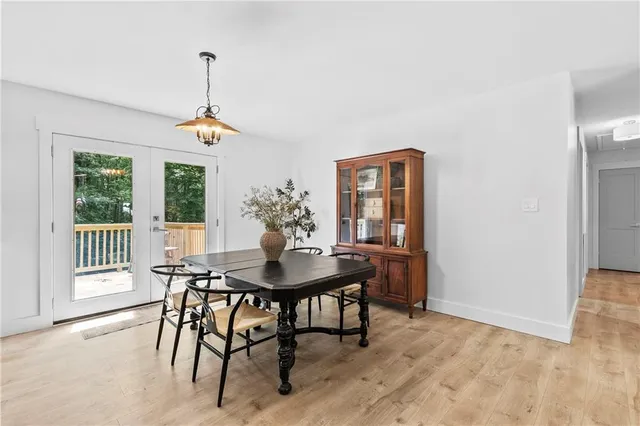 a view of a dining room with furniture and window