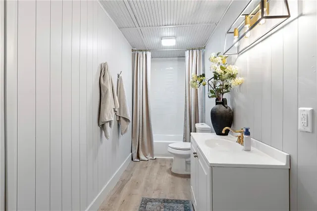 a view of bathroom with a sink and mirror
