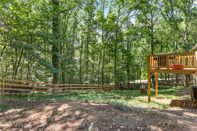 a view of a park with large trees