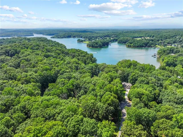 a view of a lake with a yard