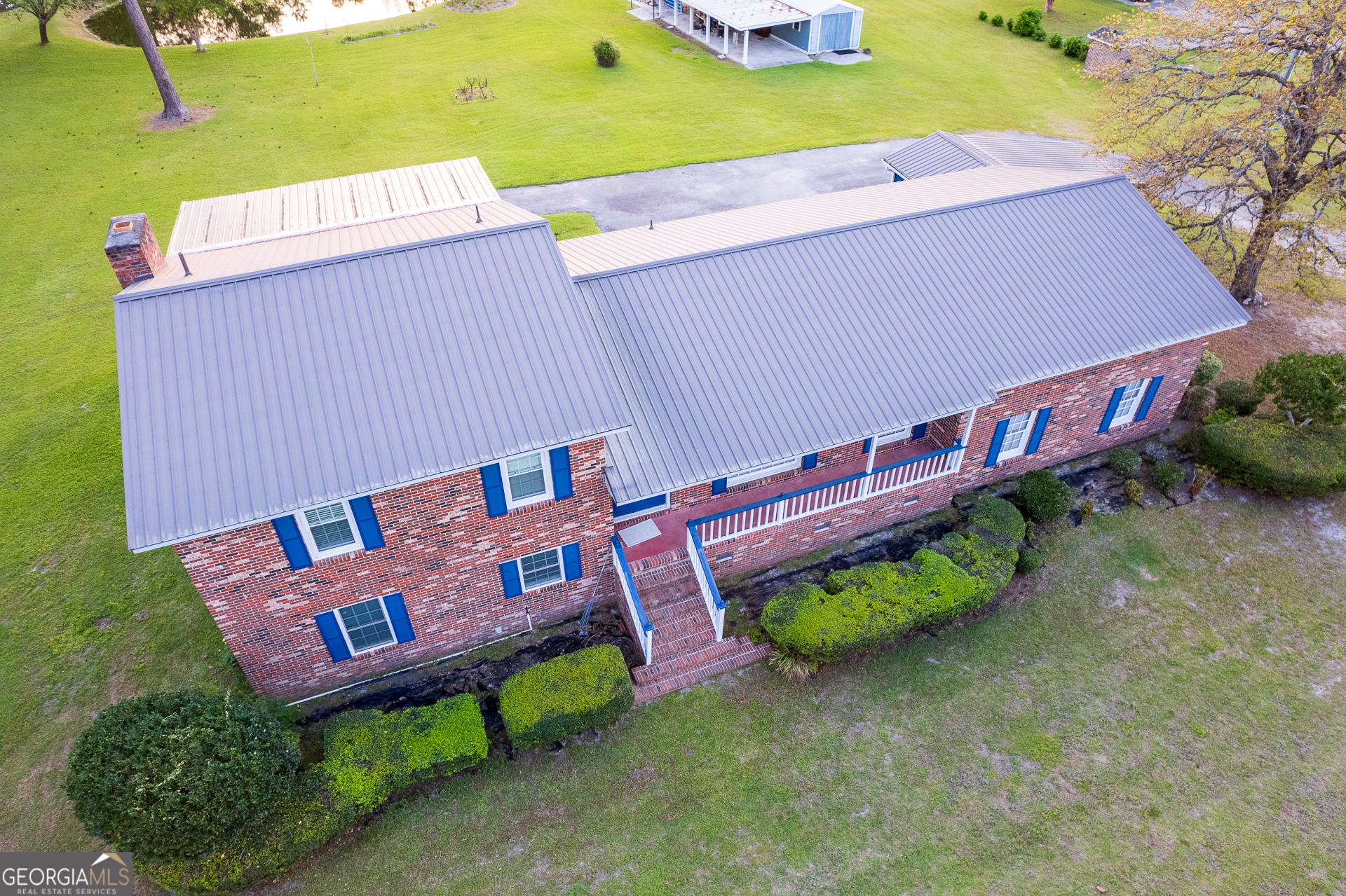 2110 Ware Street Blackshear, GA 31516 - Photo 55 of 57 an aerial view of a house with garden space and street view
