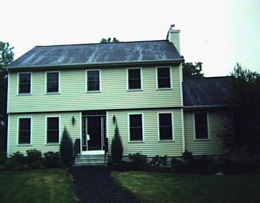 5 Maltbie Road Newtown, CT 06470 - Photo 1 of 1 a view of a house with brick walls and a yard with plants