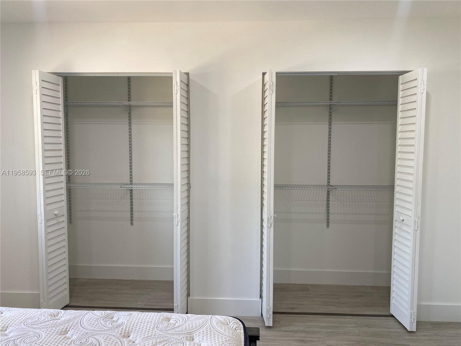 7175 Northwest 179th Street, Unit 302 Hialeah, FL 33015 - Photo 21 of 49 a bathroom with a glass door and shower