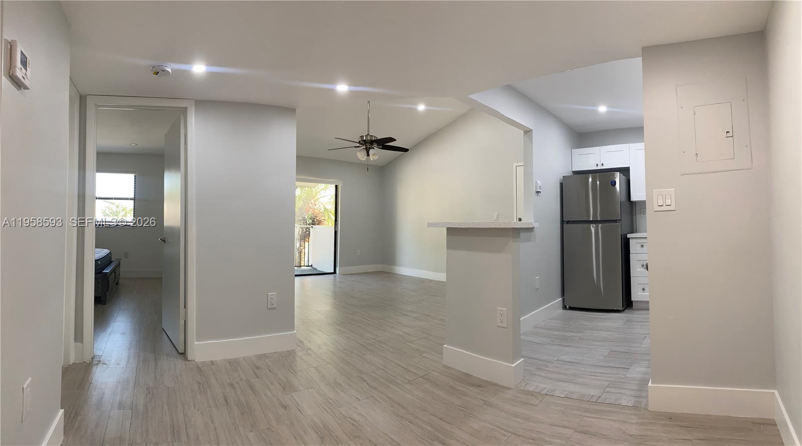 7175 Northwest 179th Street, Unit 302 Hialeah, FL 33015 - Photo 29 of 49 a view of an empty room and wooden floor