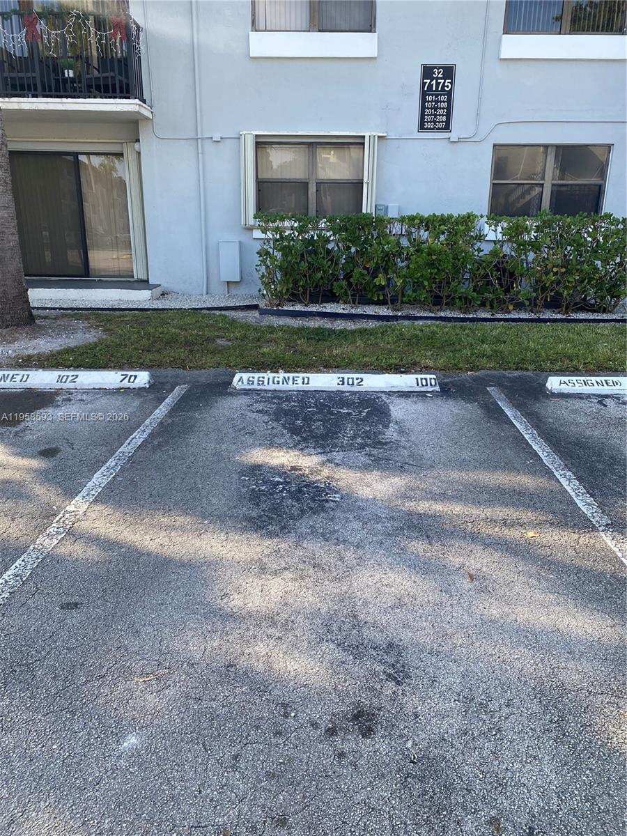 7175 Northwest 179th Street, Unit 302 Hialeah, FL 33015 - Photo 3 of 49 a view of a house with a yard
