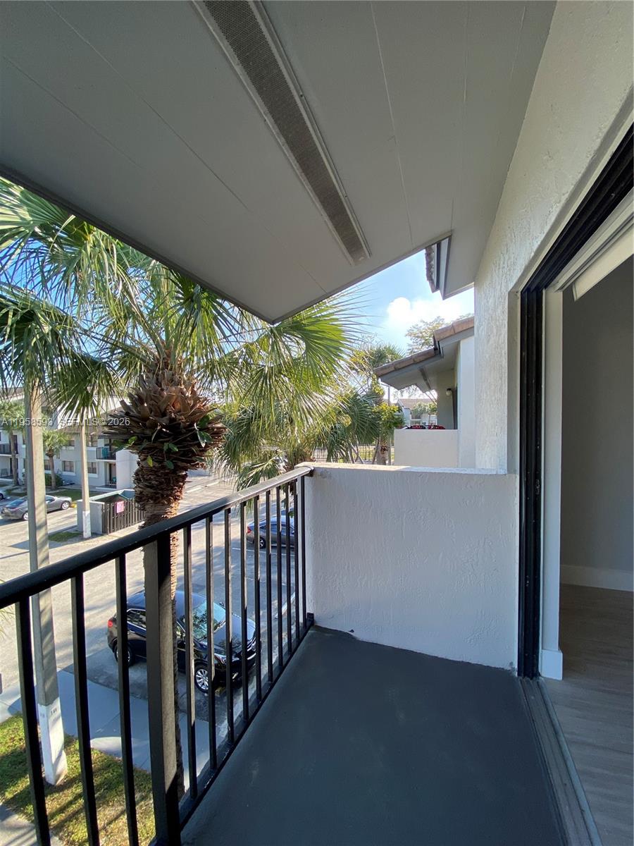 7175 Northwest 179th Street, Unit 302 Hialeah, FL 33015 - Photo 36 of 49 a view of a porch