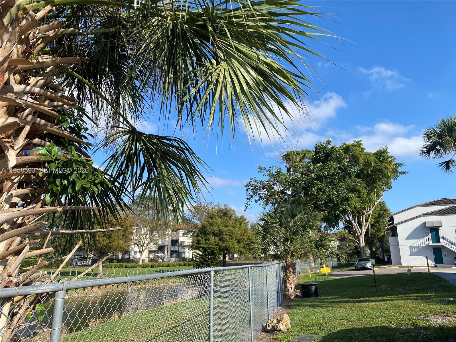 7175 Northwest 179th Street, Unit 302 Hialeah, FL 33015 - Photo 39 of 49 a view of outdoor space and yard
