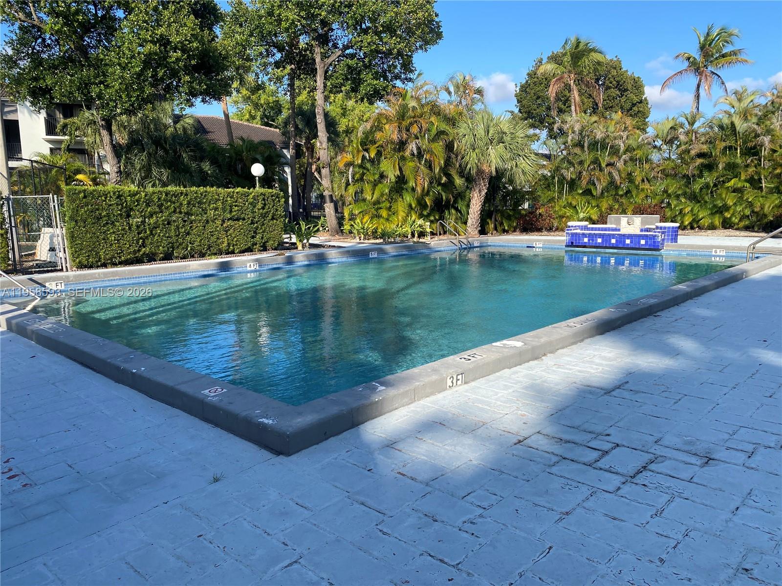 7175 Northwest 179th Street, Unit 302 Hialeah, FL 33015 - Photo 40 of 49 a view of a park with large trees