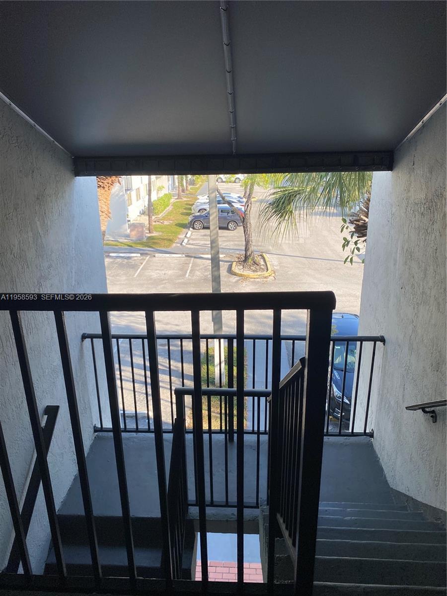 7175 Northwest 179th Street, Unit 302 Hialeah, FL 33015 - Photo 4 of 49 a view of a large window with an outdoor space