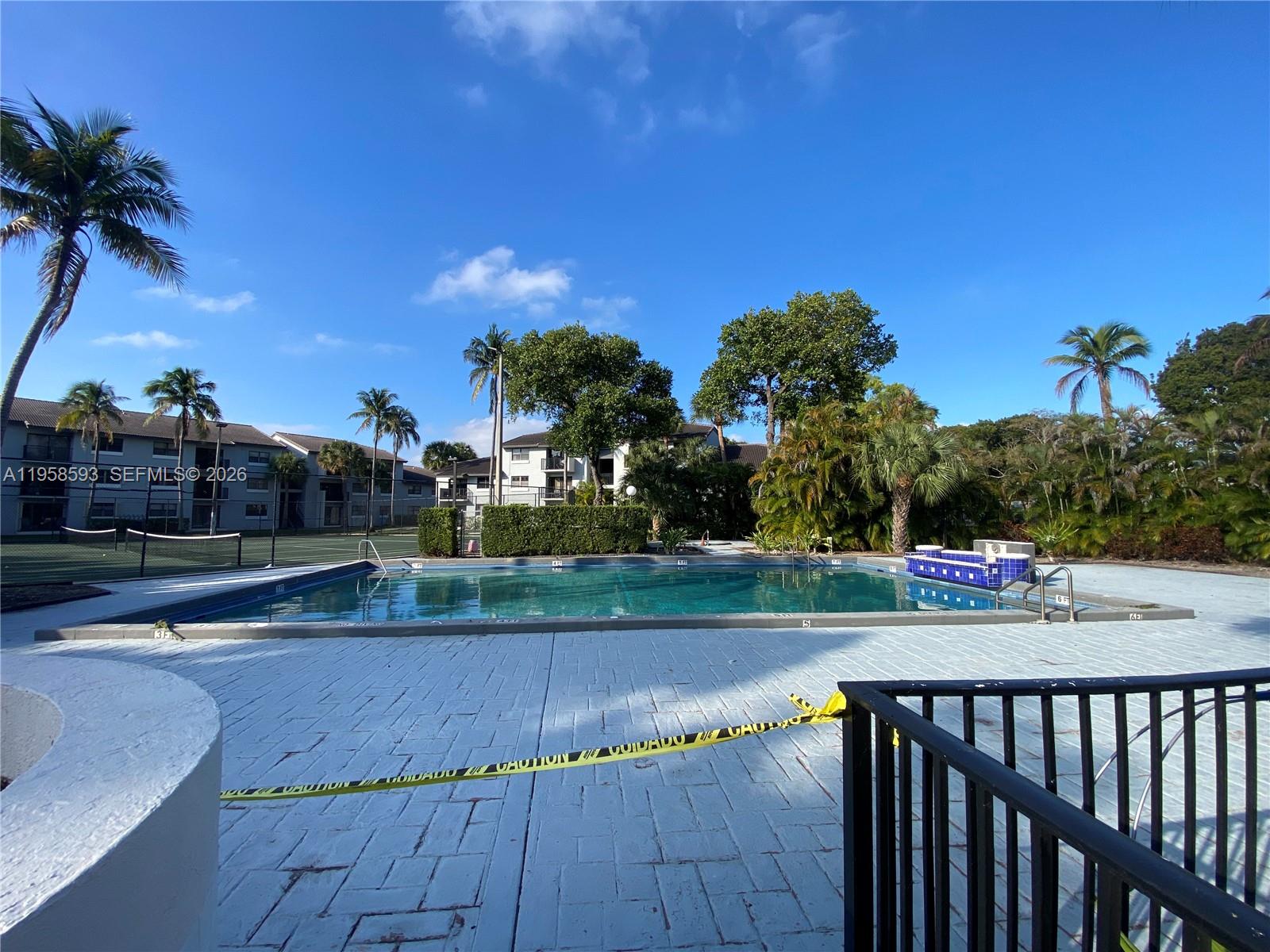 7175 Northwest 179th Street, Unit 302 Hialeah, FL 33015 - Photo 41 of 49 a view of a street with a houses