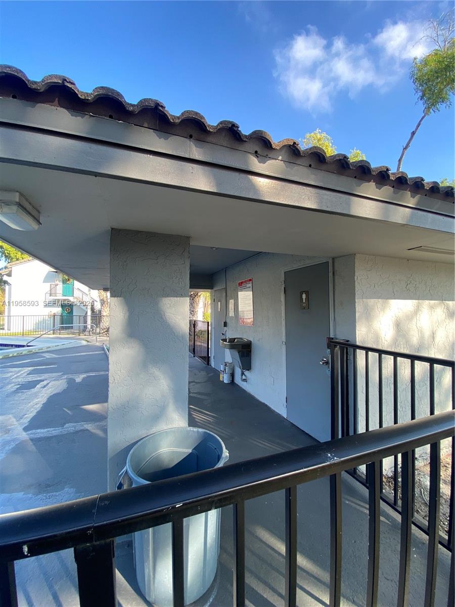 7175 Northwest 179th Street, Unit 302 Hialeah, FL 33015 - Photo 42 of 49 a view of a house with a porch