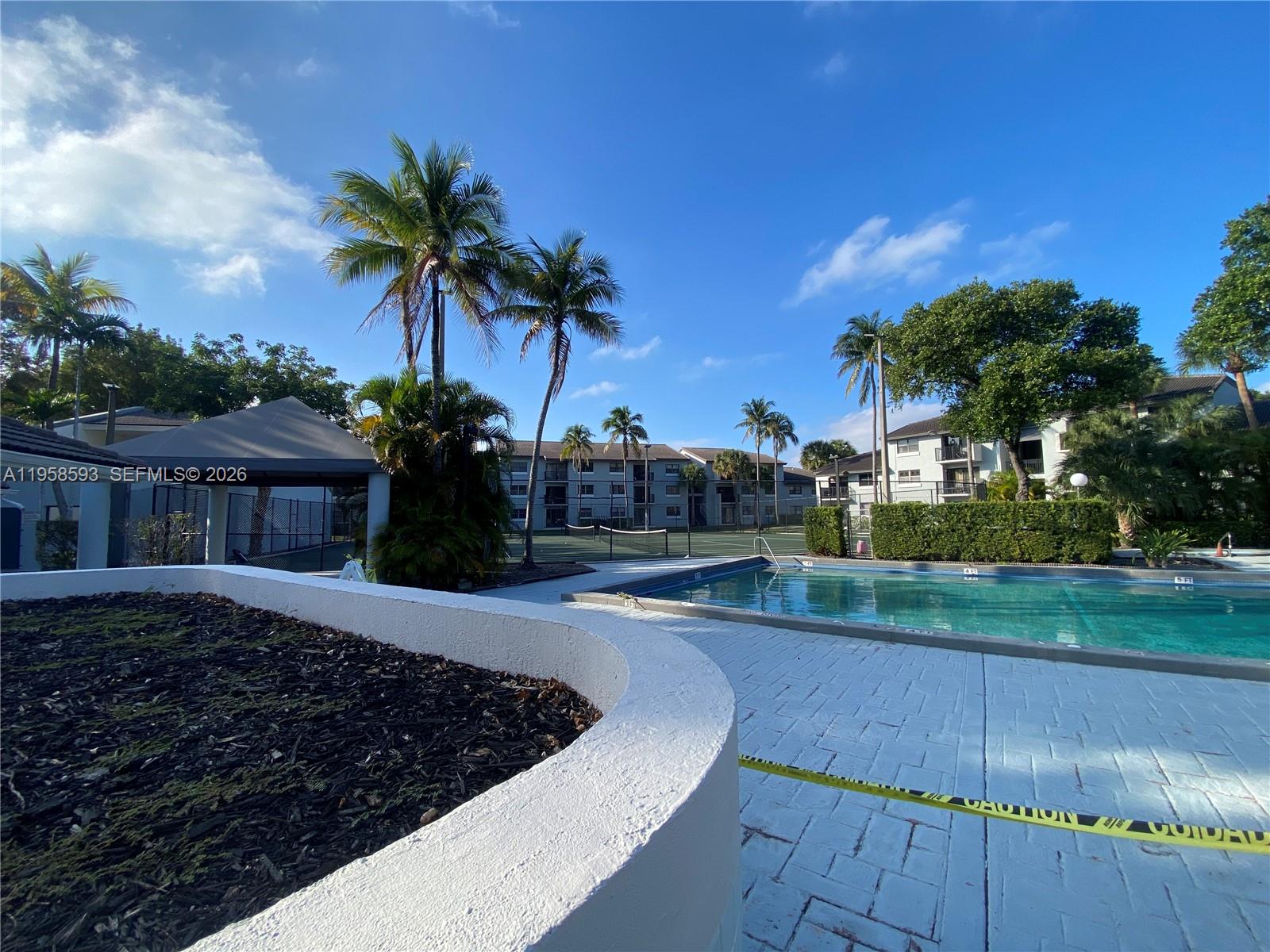7175 Northwest 179th Street, Unit 302 Hialeah, FL 33015 - Photo 44 of 49 a view of a backyard