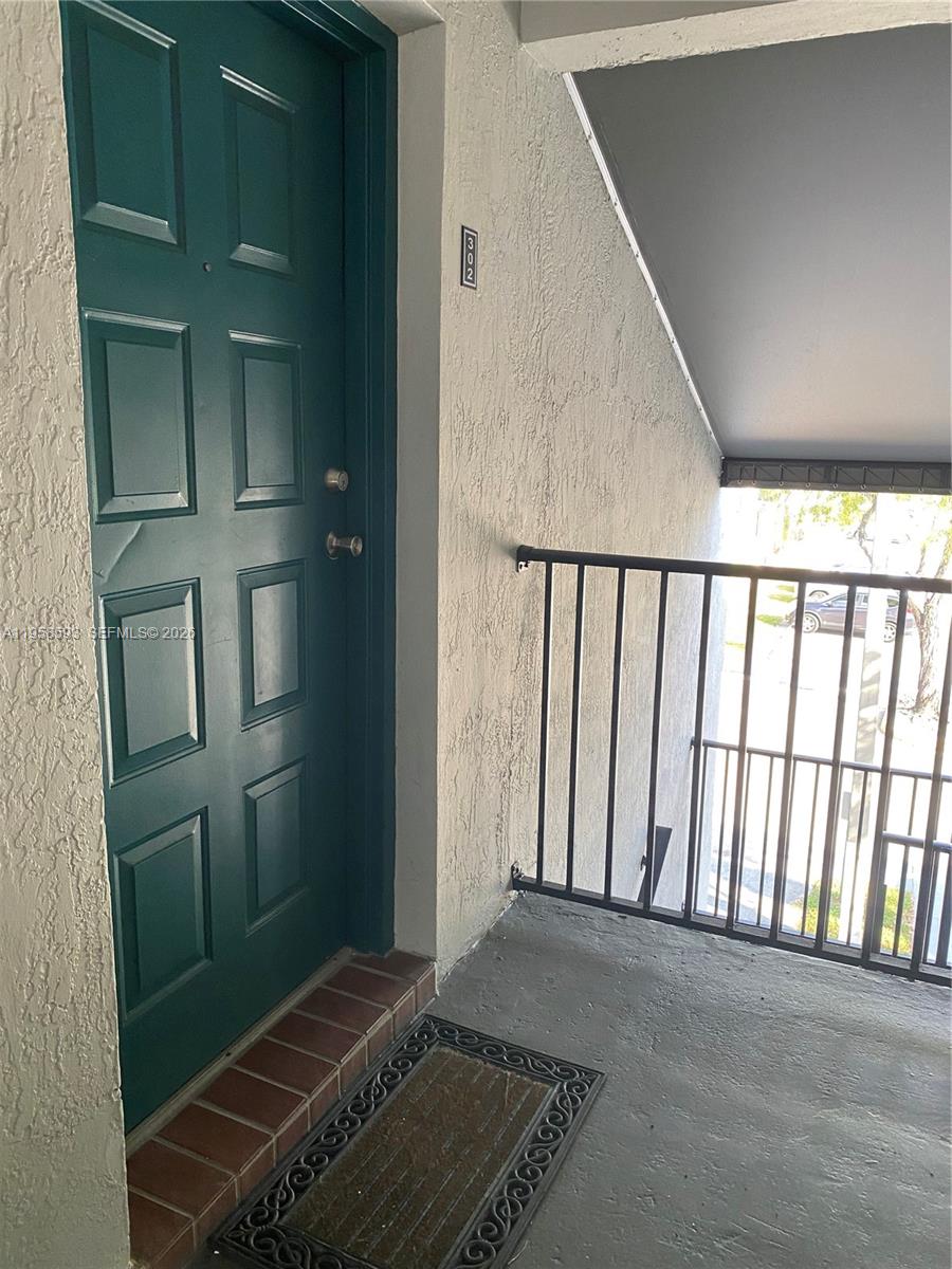 7175 Northwest 179th Street, Unit 302 Hialeah, FL 33015 - Photo 5 of 49 a view of an entryway