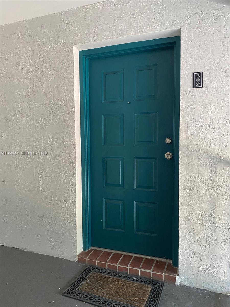 7175 Northwest 179th Street, Unit 302 Hialeah, FL 33015 - Photo 6 of 49 a room with a mirror