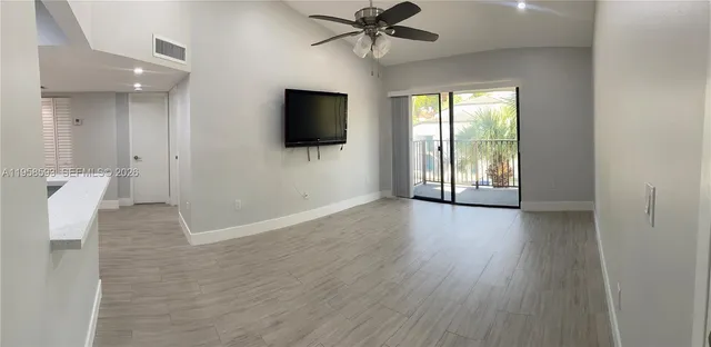 a view of a livingroom with a flat screen tv