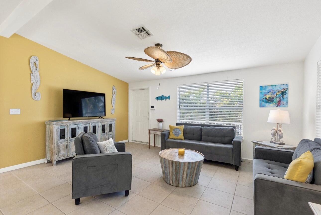 157 Mars Lane Key West, FL 33040 - Photo 10 of 41 a living room with furniture and a flat screen tv