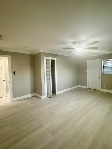 a view of an empty room with windows